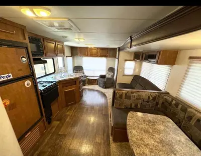 a kitchen and living room of an rv at Rooms in Modern RV Trailer Home in Los Angeles