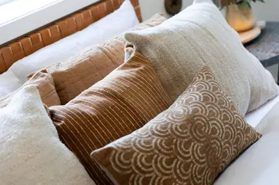 a group of pillows sitting on a bed at Zen Birds Nest of Topanga Boho Chic with Epic Deck in Topanga