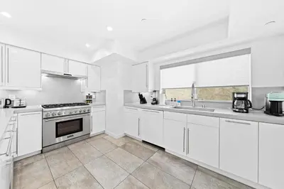 a white kitchen with white cabinets and a window at The Diamond Dune - Upscale 3 Level 4BR Terrace Santa Monica in Los Angeles