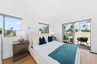 a white bedroom with a bed and windows at The Diamond Dune - Upscale 3 Level 4BR Terrace Santa Monica in Los Angeles