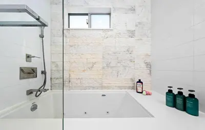 a white bathroom with a tub and a window at The Diamond Dune - Upscale 3 Level 4BR Terrace Santa Monica in Los Angeles