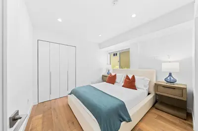 a white bedroom with a bed with two pillows at The Diamond Dune - Upscale 3 Level 4BR Terrace Santa Monica in Los Angeles