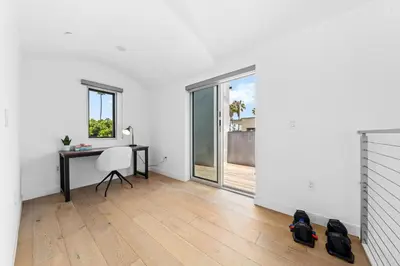an empty white room with a desk and a window at The Diamond Dune - Upscale 3 Level 4BR Terrace Santa Monica in Los Angeles
