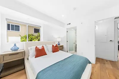 a white bedroom with a large bed and a window at The Diamond Dune - Upscale 3 Level 4BR Terrace Santa Monica in Los Angeles