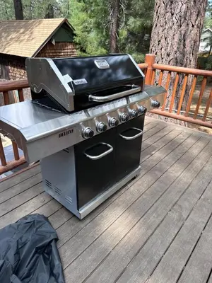 a grill sitting on top of a deck at Château Bouli - 4 Season Escape and Games Room in Big Bear Lake