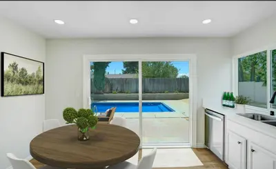 a kitchen and dining room with a table and a pool at Lancaster Pool Home in Lancaster