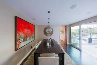 a living room with a large painting on the wall at Casa Azul in Los Angeles