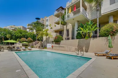 a swimming pool in front of a building at 2 Mi to Hollywood Condo with Pool and Hot Tub Access in Los Angeles