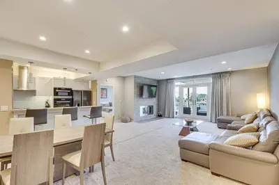 a living room and kitchen with a couch and a table at 2 Mi to Hollywood Condo with Pool and Hot Tub Access in Los Angeles