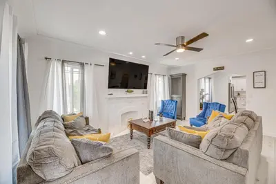 a living room with two couches and a fireplace at 2 Mi to Citadel Outlets! East LA Retreat Near I-5 in Los Angeles