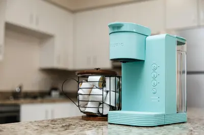 a blue blender sitting on top of a counter at Gorgeous studio steps from The Groove in Los Angeles