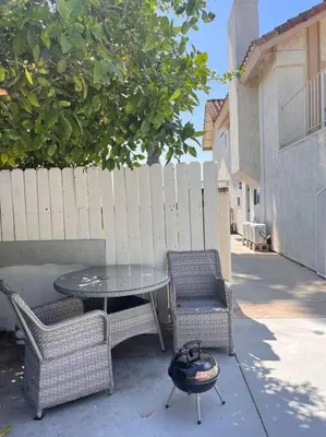 a patio with a table and two chairs and a grill at Studio Living,Quiet Neighborhood, Near Airport in Walnut