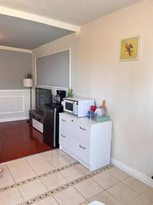 a kitchen with a microwave and a refrigerator at Studio Living,Quiet Neighborhood, Near Airport in Walnut