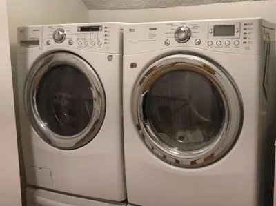 two white washing machines sitting next to each other at Skyhill Pool - Walk to Universal - Resort-Style Home in Los Angeles