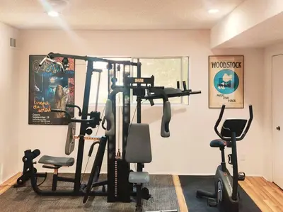 a gym with several exercise bikes in a room at Skyhill Pool - Walk to Universal - Resort-Style Home in Los Angeles