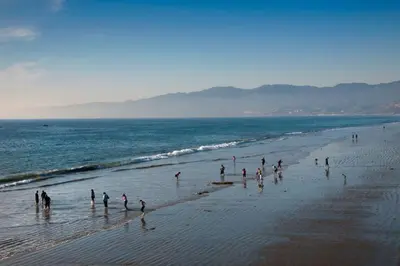 a group of people standing on a beach at Beachside Luxury Apartment I Free Parking in Los Angeles