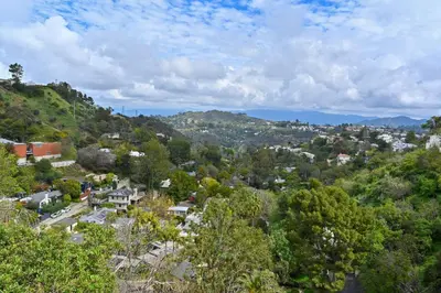 an aerial view of a town in the hills at Hollywood Hills Retreat with Panoramic View in Los Angeles