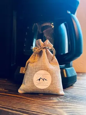 a bag sitting on a table next to a tea pot at Family-friendly, AC, Hot Tub, Walk 2 Park & Lake in Big Bear Lake