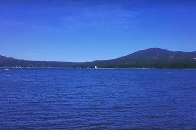 a large body of water with mountains in the background at Family-friendly, AC, Hot Tub, Walk 2 Park & Lake in Big Bear Lake