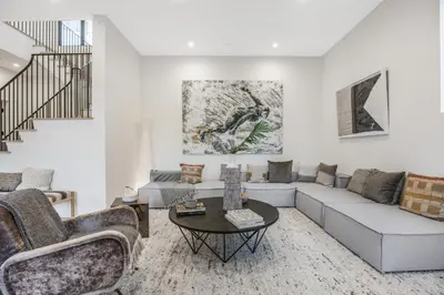 a living room with a couch and a table at Belden Modern Villa in Los Angeles
