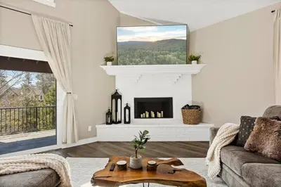 a living room with a fireplace and a couch at Oak Mountain Retreat, Hot Tub, & BBQ, Game Room! in Lake Arrowhead
