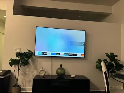 a flat screen tv hanging on a wall at Stylish and Elegant apartment in Glendale