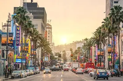a busy city street filled with cars and palm trees at Stylish and Elegant apartment in Glendale