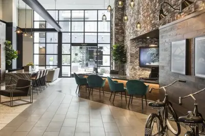 a room with a table and chairs in a building at Stylish and Elegant apartment in Glendale
