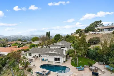 an aerial view of a house with a swimming pool at Bouquet Cottage home in Thousand Oaks