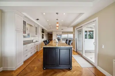 a kitchen with a large island in the middle at Bouquet Cottage home in Thousand Oaks