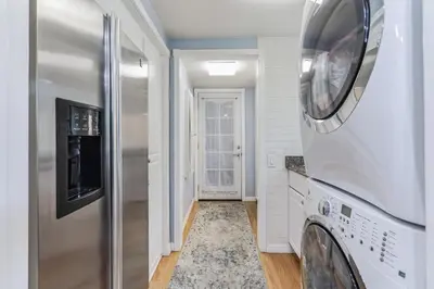 a laundry room with a washer and dryer at Bouquet Cottage home in Thousand Oaks