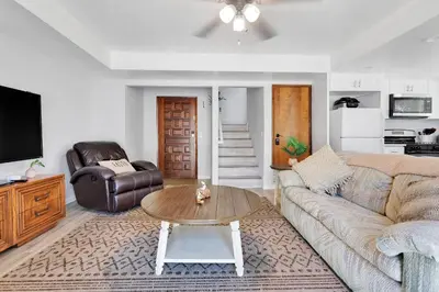 a living room with a couch and a coffee table at Oasis Condo on the Fairway in Victorville