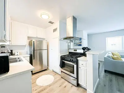 a kitchen with a stainless steel stove and refrigerator at Charming 2-BR, 2-Story Retreat in Heart of LA - BR4 in Los Angeles