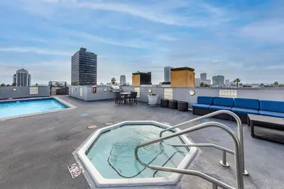 a hot tub on the roof of a building at Travel Haven at Miracle Mile- 110 in Los Angeles