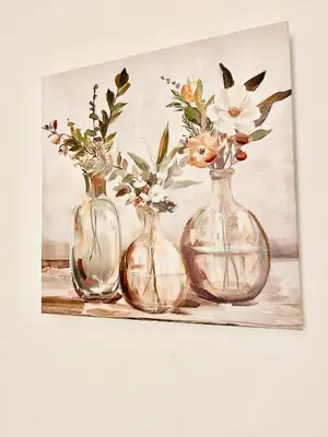 three glass vases with flowers on a shelf at Coastal Comfort Homestay in Santa Monica in Los Angeles