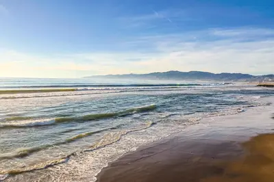 a view of a beach with waves in the ocean at Gorgeous 1 Bedroom Apartment#7 in Los Angeles