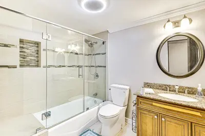 a bathroom with a toilet and a shower and a sink at Game Room, Pool! Family Home 25 Mi to Disneyland in West Covina