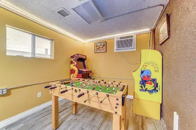 a room with a foosball table and a board at Game Room, Pool! Family Home 25 Mi to Disneyland in West Covina