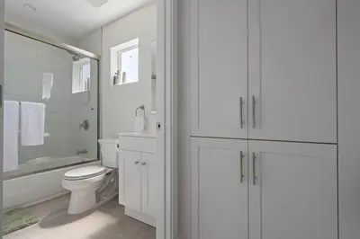 a white bathroom with a toilet and a sink at Prime new beautiful studio in burbank in Burbank