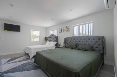 a bedroom with two twin beds and a bedskirts at Prime new beautiful studio in burbank in Burbank