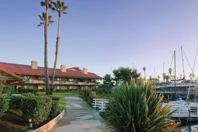 a resort with palm trees and a marina at Beautiful Resort in Harbortown Point 1BD near Marina Park in Ventura