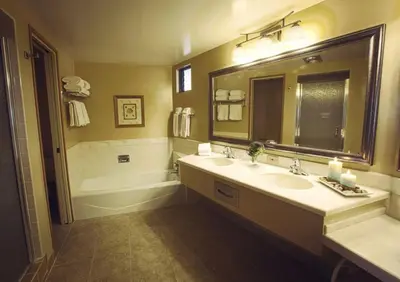 a bathroom with a sink and a tub and a mirror at Beautiful Resort in Harbortown Point ST near Marina Park in Ventura