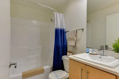 a bathroom with a sink and a toilet and a shower at Lavish Living Lux Marina Views in Los Angeles