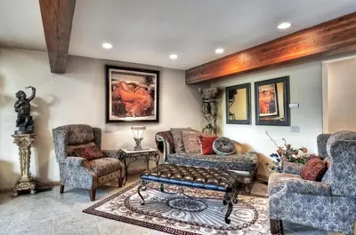a living room with two chairs and a couch at No. 8 Estate By The Lake in Big Bear Lake