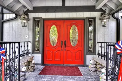 a red door on a house with a flag at No. 8 Estate By The Lake in Big Bear Lake
