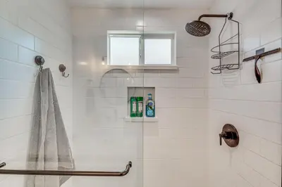 a bathroom with a shower with a glass door at 7 Mi to DTLA! Family Home with Furnished Deck in Los Angeles
