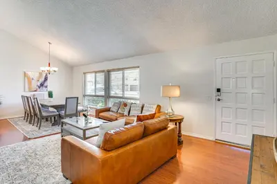a living room with a couch and a table at Huntington Beach Home Fire Pit, Grill and More! in Huntington Beach