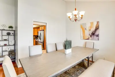 a dining room with a wooden table and chairs at Huntington Beach Home Fire Pit, Grill and More! in Huntington Beach