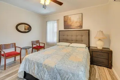 a bedroom with a bed and two chairs and a table at 2 Mi to SoFi Stadium Updated Inglewood Home! in Los Angeles