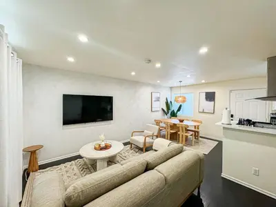a living room with a couch and a table at Bohemian Dream- 2BR, Retreat Near Hollywood -BR6 in Los Angeles